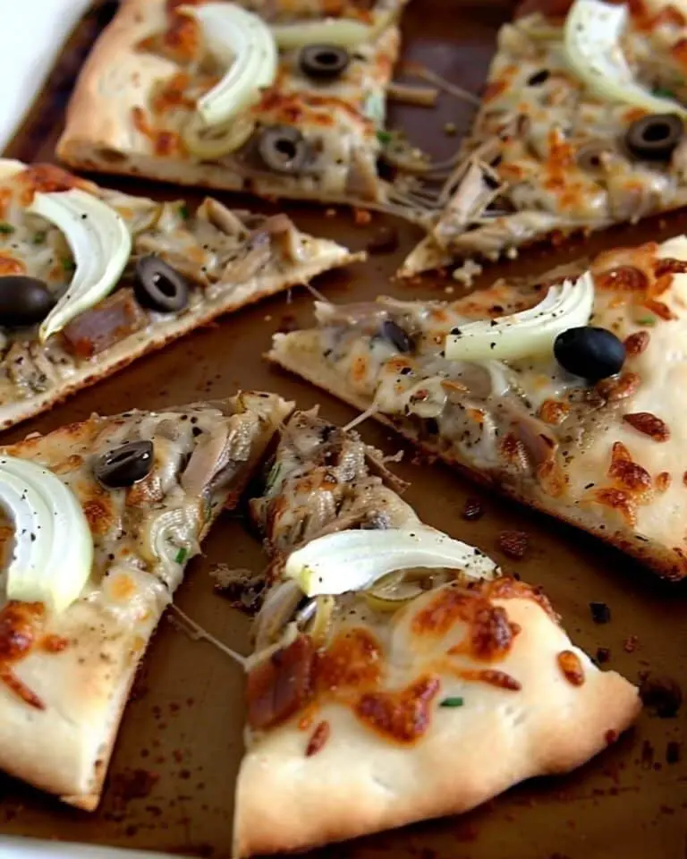 Flatbread with White Bean Hummus, Caramelized Onions, Black Olives and Spanish White Anchovies